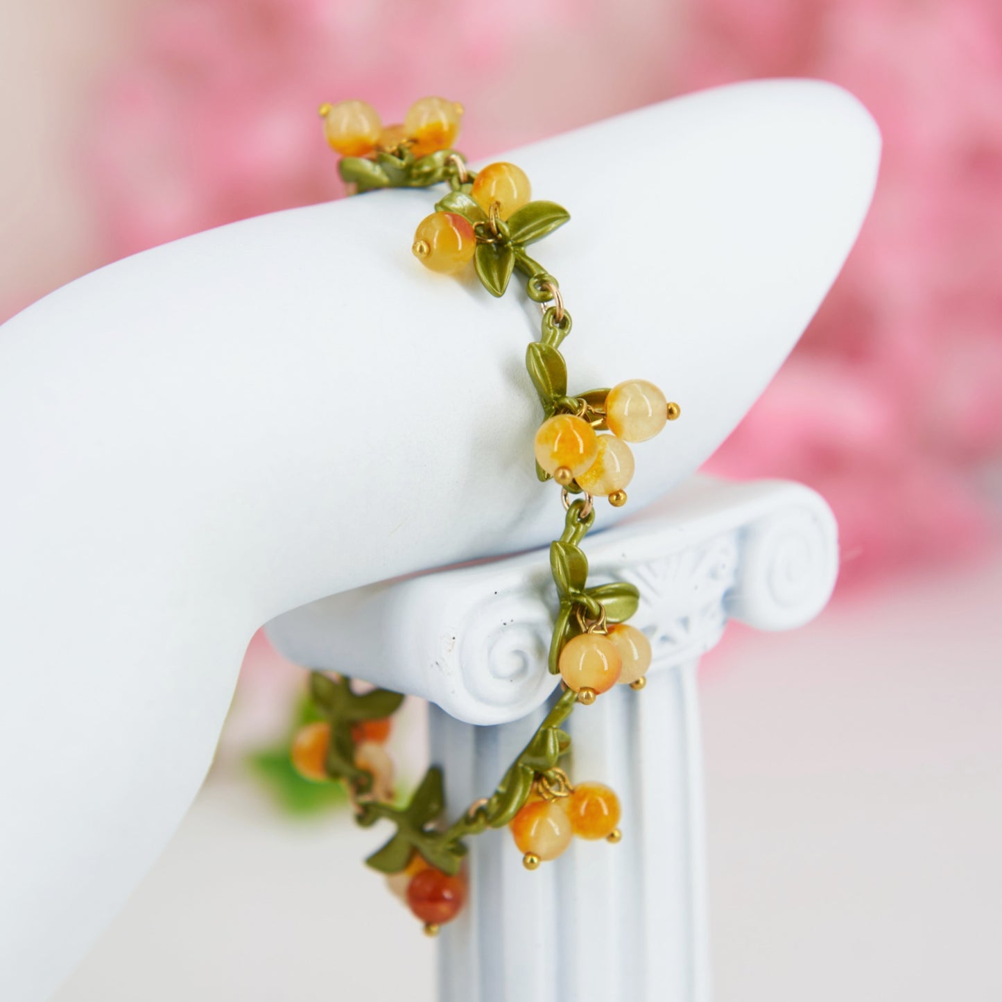 Cottagecore yellow and green chain bracelet with leaves and berry shaped glass beads.