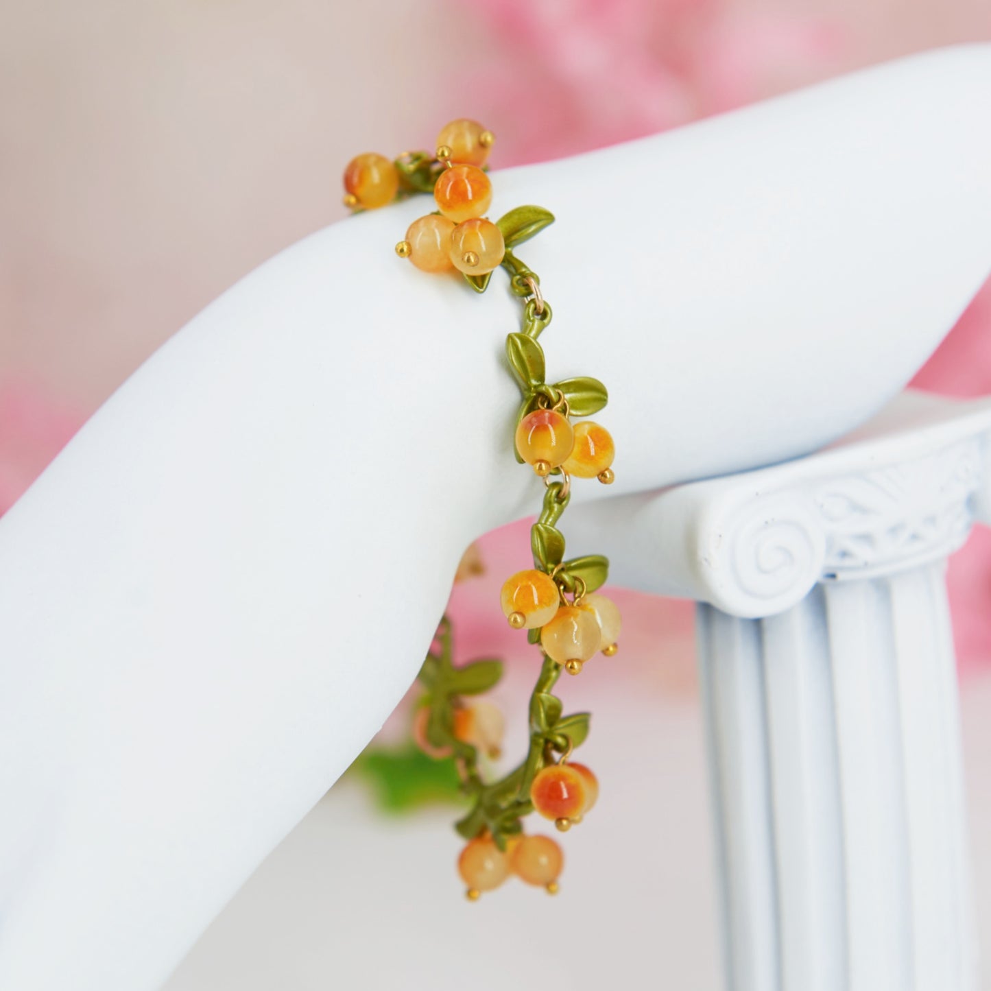 Cottagecore yellow and green chain bracelet with leaves and berry shaped glass beads.