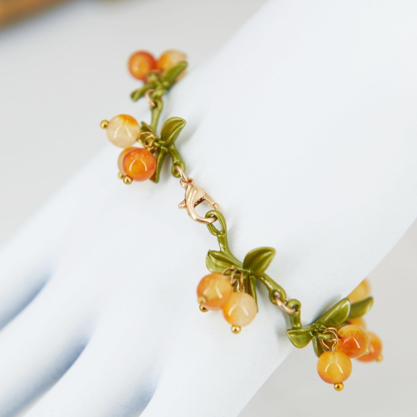 Cottagecore yellow and green chain bracelet with leaves and berry shaped glass beads.