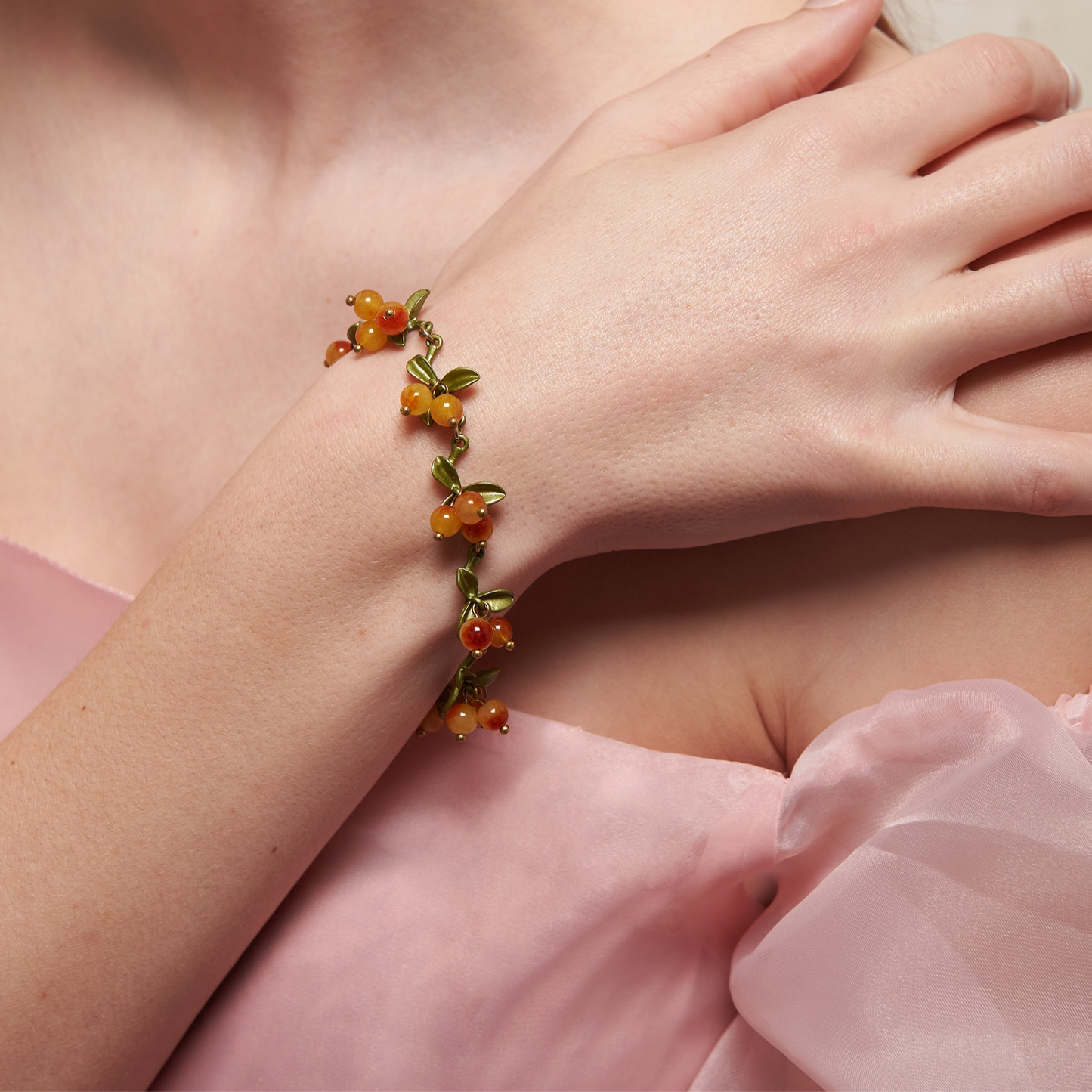 Cottagecore yellow and green chain bracelet with leaves and berry shaped glass beads.