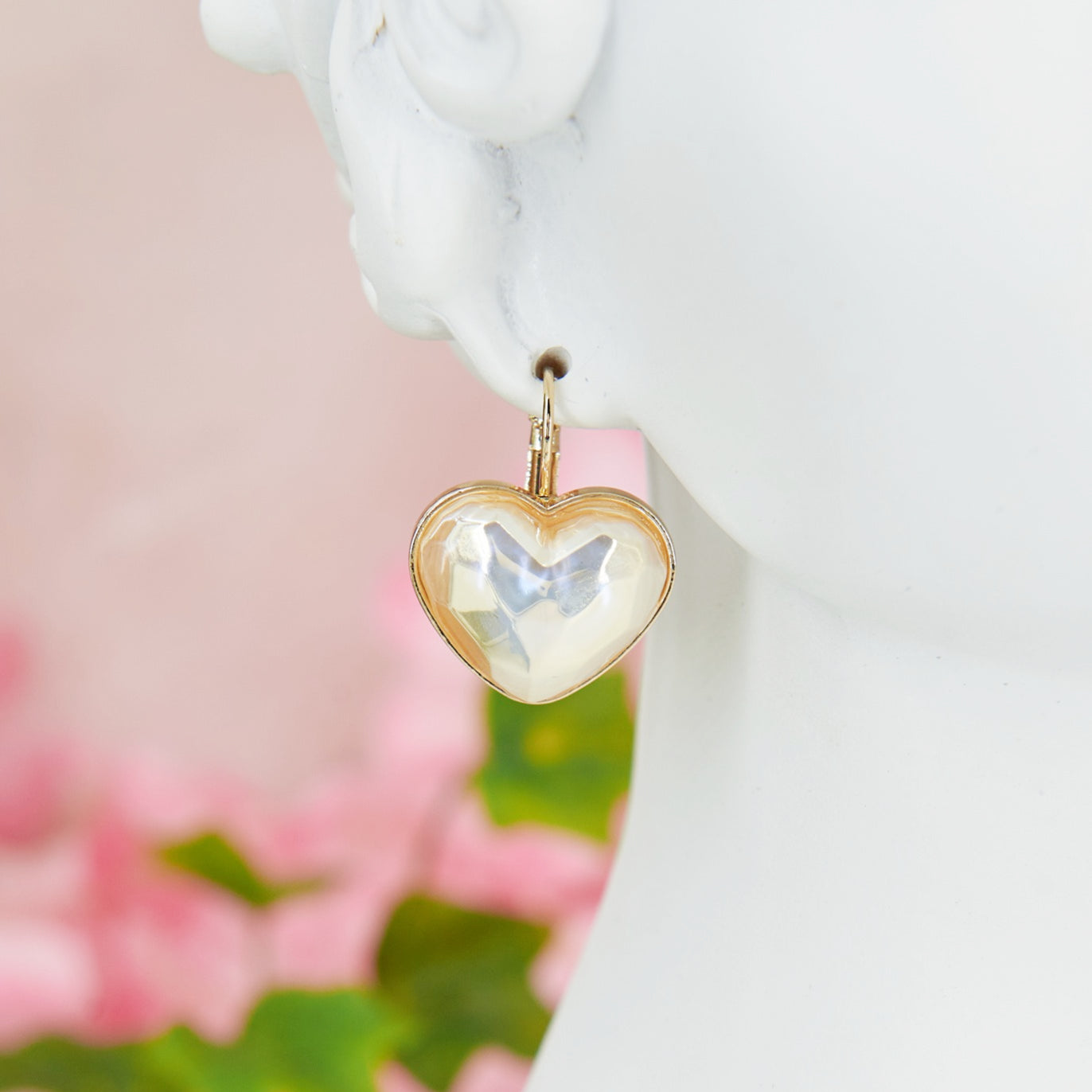 Delicate and romantic heart shaped earrings with iridescent reflections, perfect for weddings and special occasions.