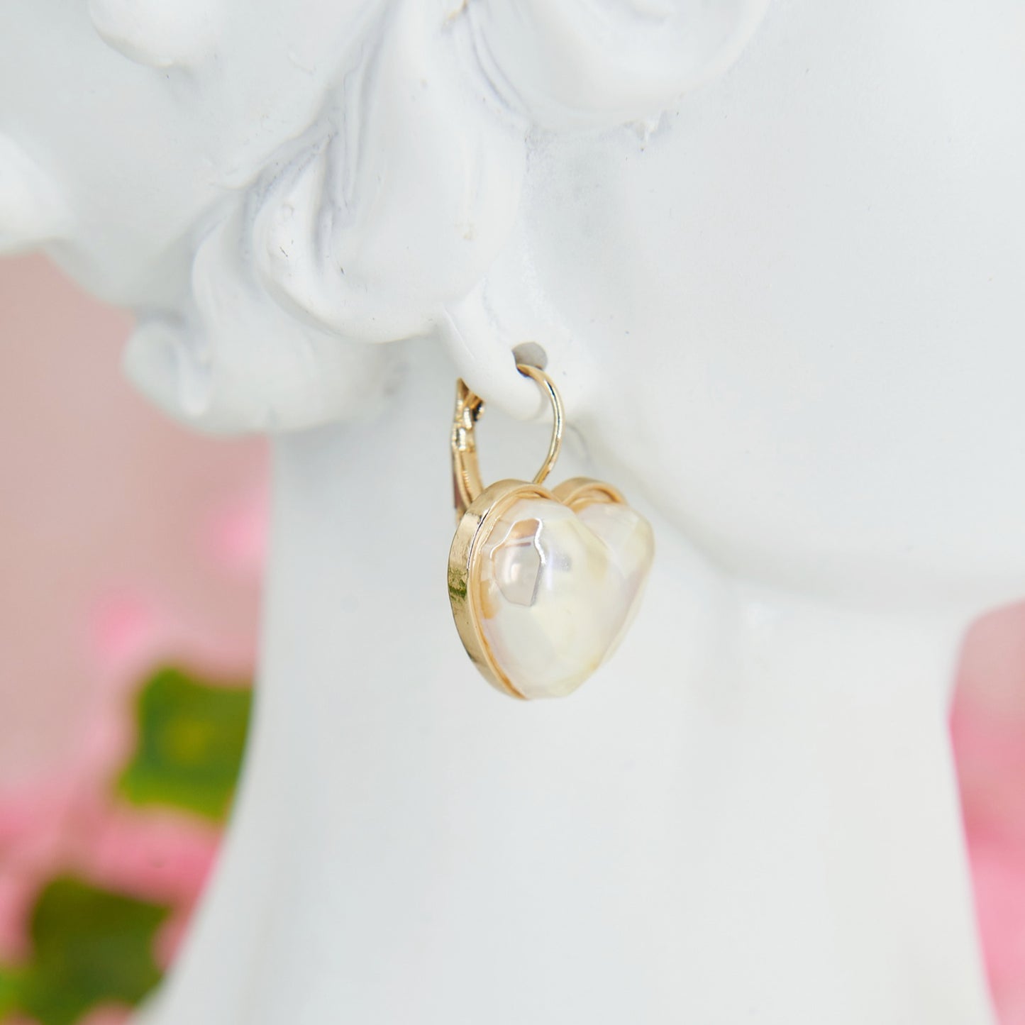 Delicate and romantic heart shaped earrings with iridescent reflections, perfect for weddings and special occasions.