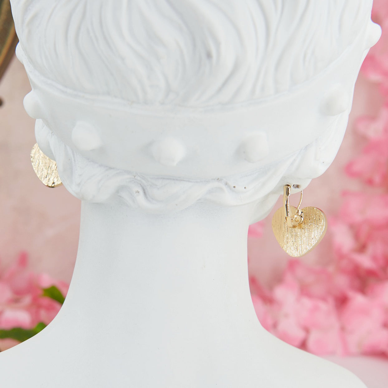 Delicate and romantic heart shaped earrings with iridescent reflections, perfect for weddings and special occasions.