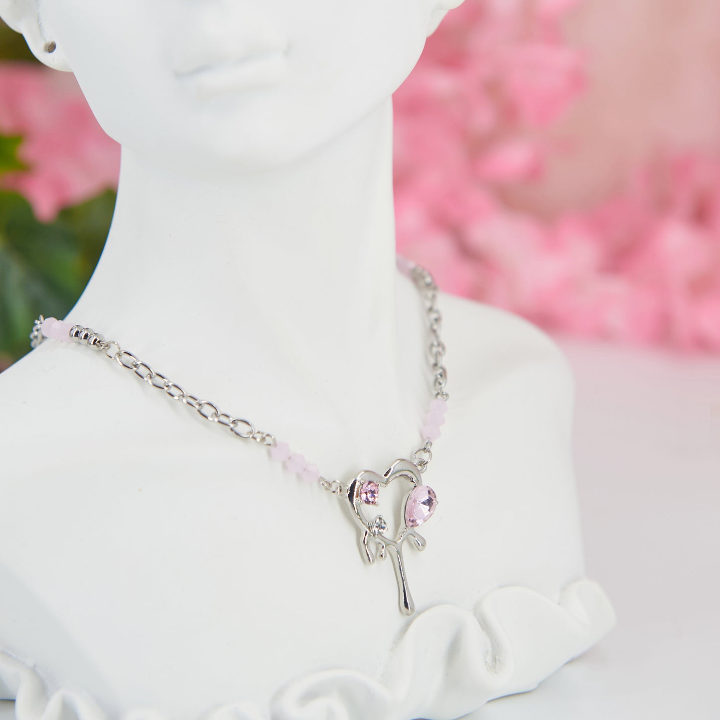 Y2K-inspired necklace with a silver-tone adjustable chain and a dripping heart pendant adorned with pink zircons. A blend of retro charm and modern shine, perfect for a nostalgic yet trendy look.