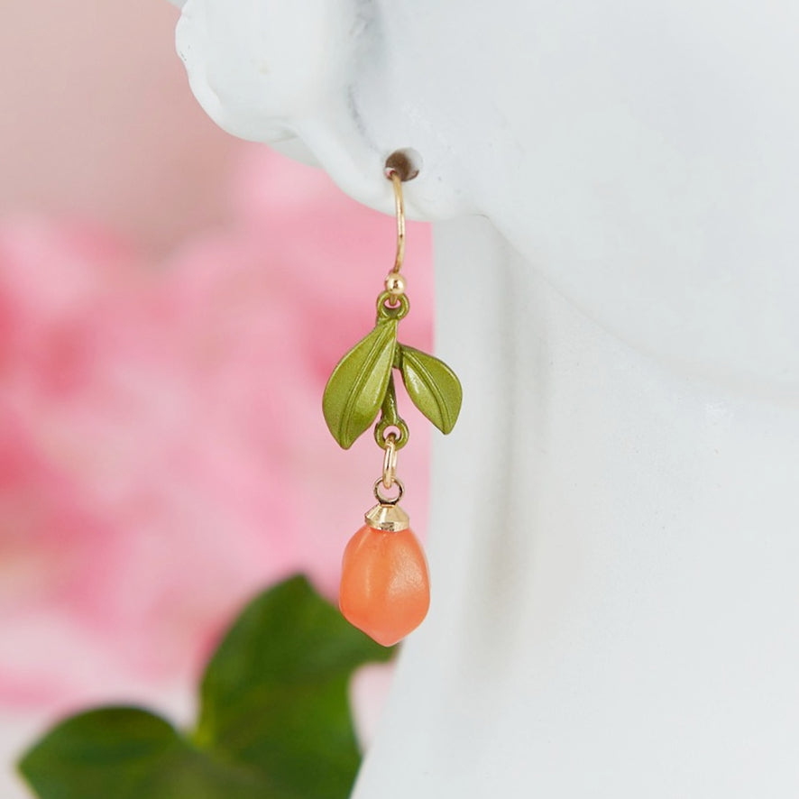 Summer-inspired zinnc & acrylic tangerine earrings. Lightweight & versatile. Fits summer cottagecore aesthetic. Adds a sunny touch to your look.