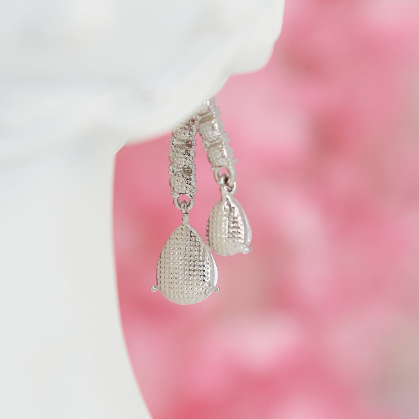 Big crystal glamour earrings in zinc alloy with zircons. 4.5 cm long. Removable back for a customizable, chic, and bright style.
