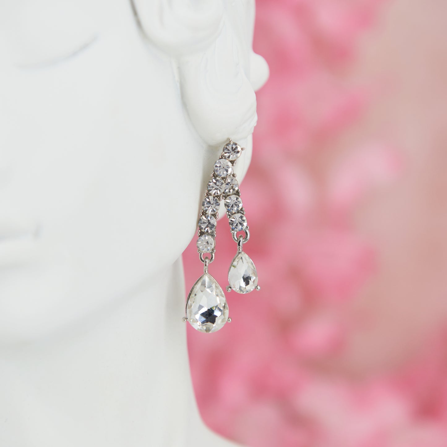Big crystal glamour earrings in zinc alloy with zircons. 4.5 cm long. Removable back for a customizable, chic, and bright style.