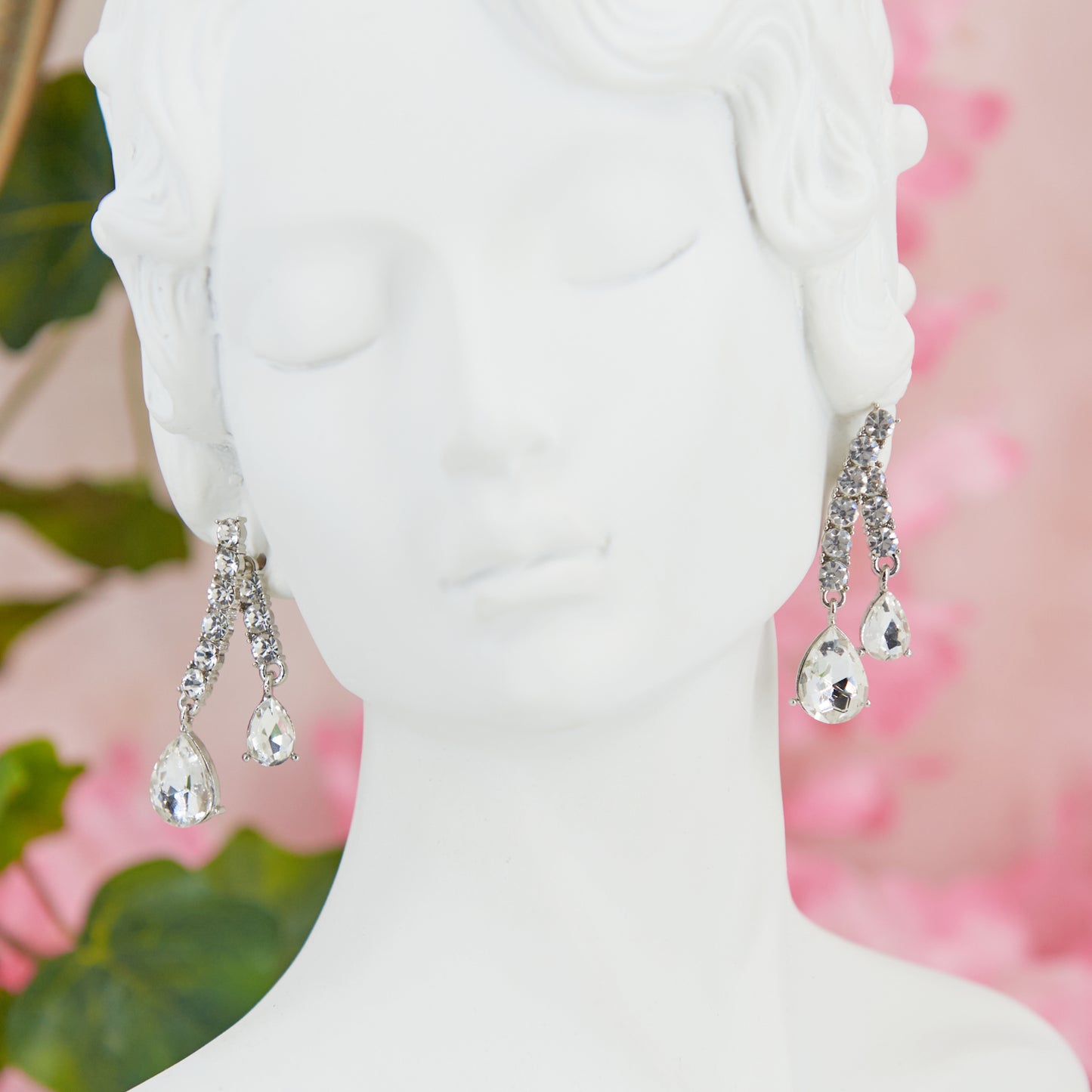 Big crystal glamour earrings in zinc alloy with zircons. 4.5 cm long. Removable back for a customizable, chic, and bright style.