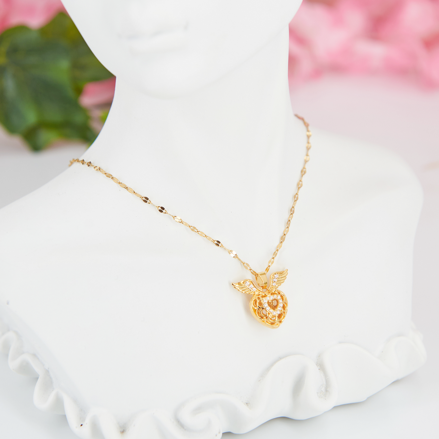 Adjustable stainless steel necklace with a winged heart pendant & white zircon stones. Inspired by Hermès, this elegant piece embodies timeless romance & sustainability.