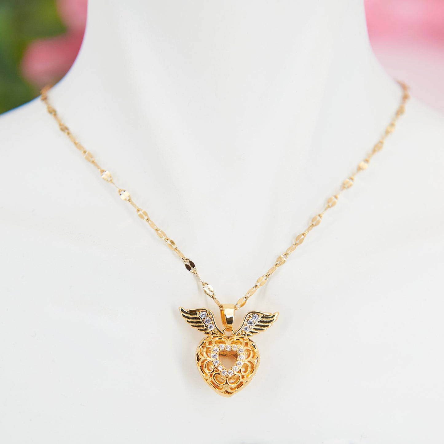 Adjustable stainless steel necklace with a winged heart pendant & white zircon stones. Inspired by Hermès, this elegant piece embodies timeless romance & sustainability.