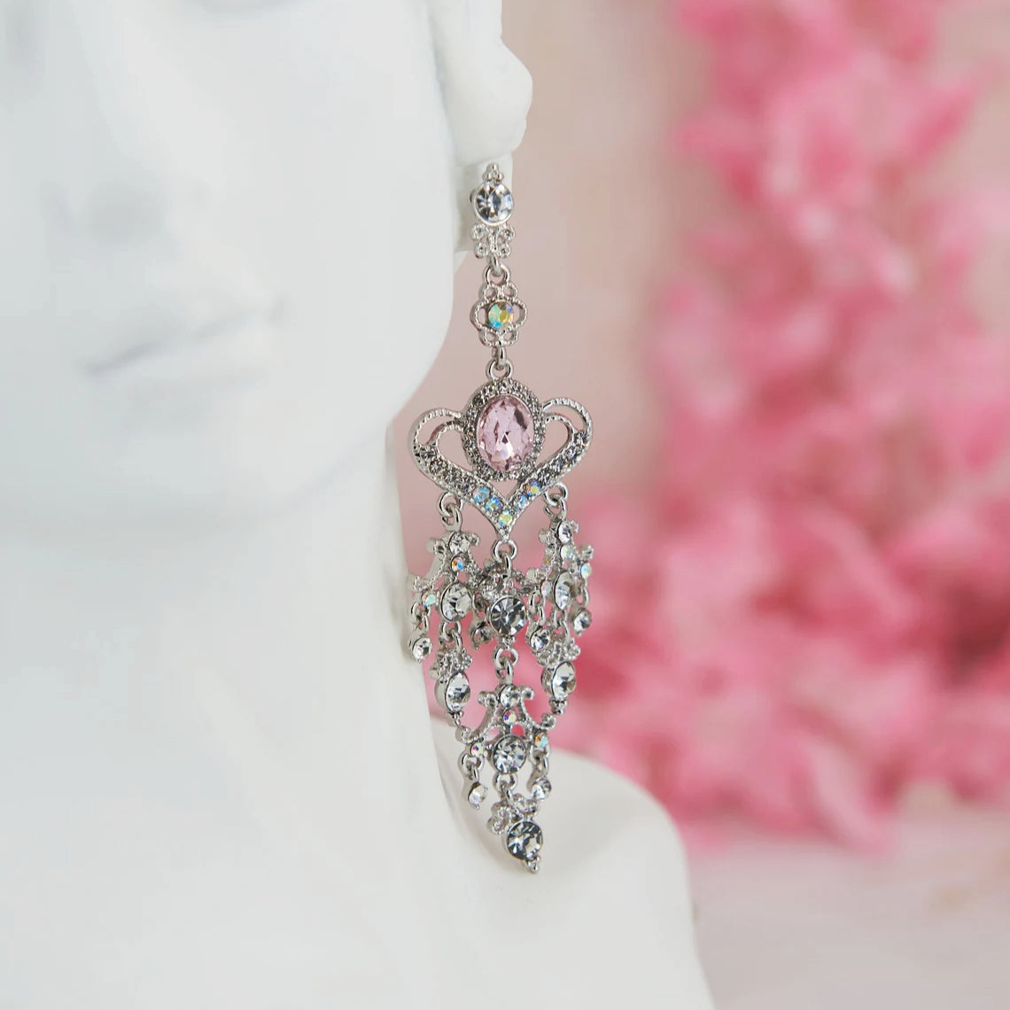Maxi chandelier earrings, 10 cm. Silver metal with white & pale pink zircons. Baroque design with a large pink zircon centerpiece. Ideal for elegant events or weddings.