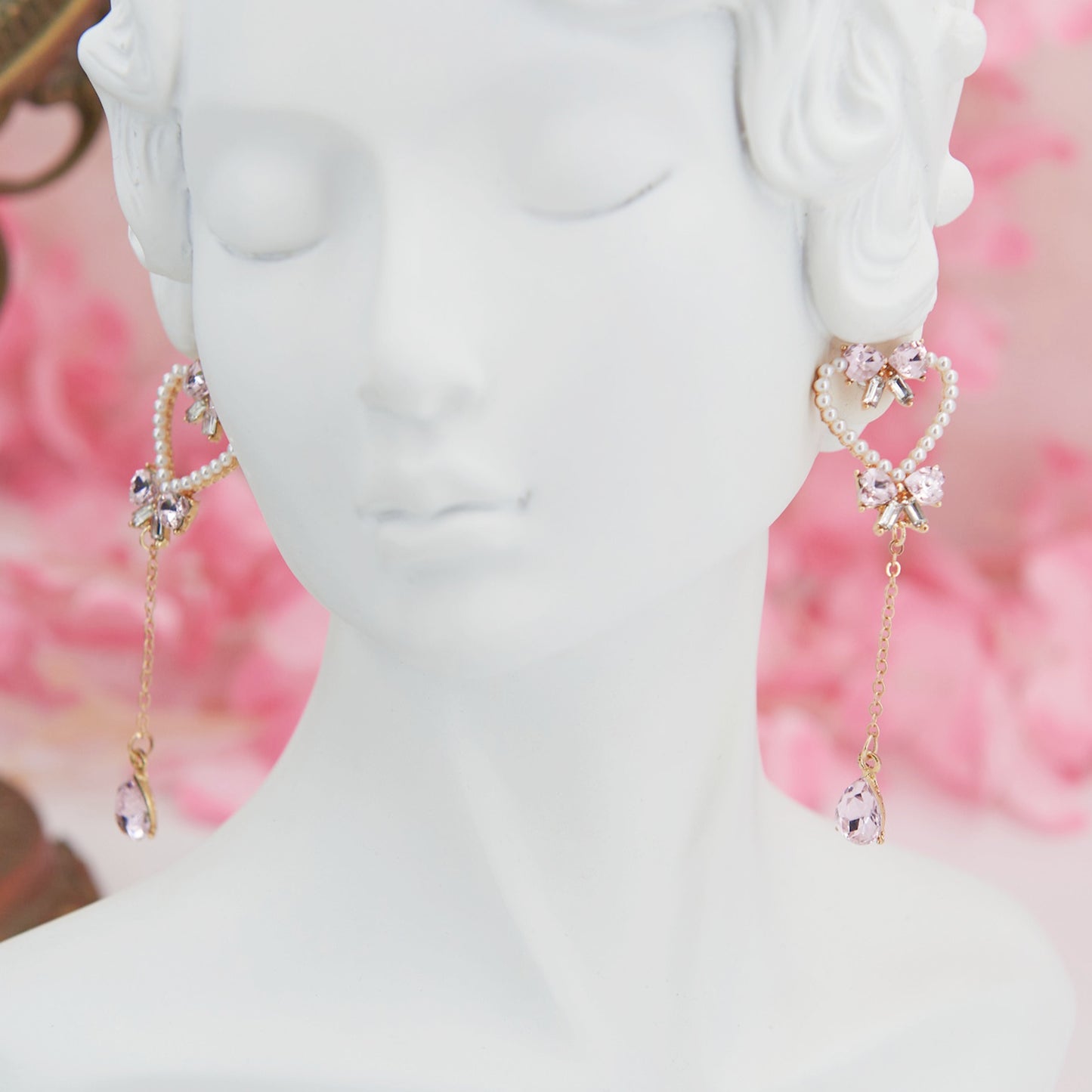 Heart-shaped earrings adorned with pearls and pink zircon teardrops—romantic, feminine, and perfect for a soft coquette look.