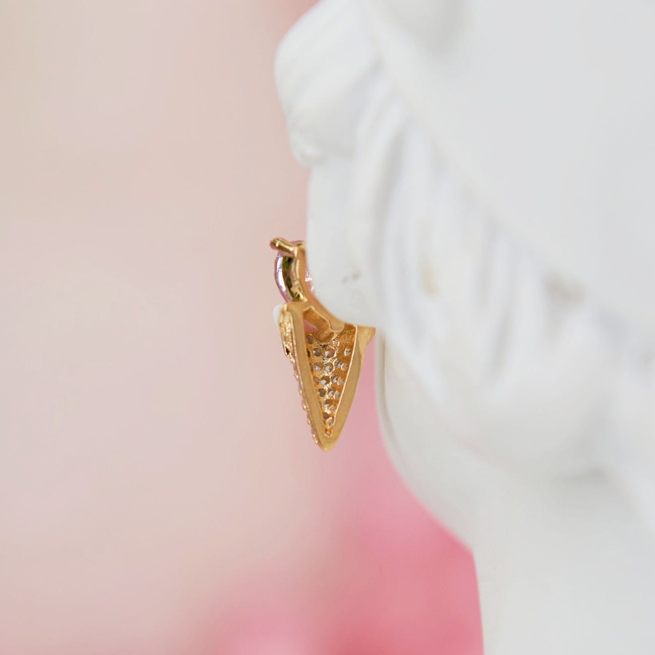 Earrings shaped like a cute ice cream cone with a soft pink heart in zircon. Embellished with sparkling zircons for a feminine touch. Perfect for adding summer sweetness to your look.