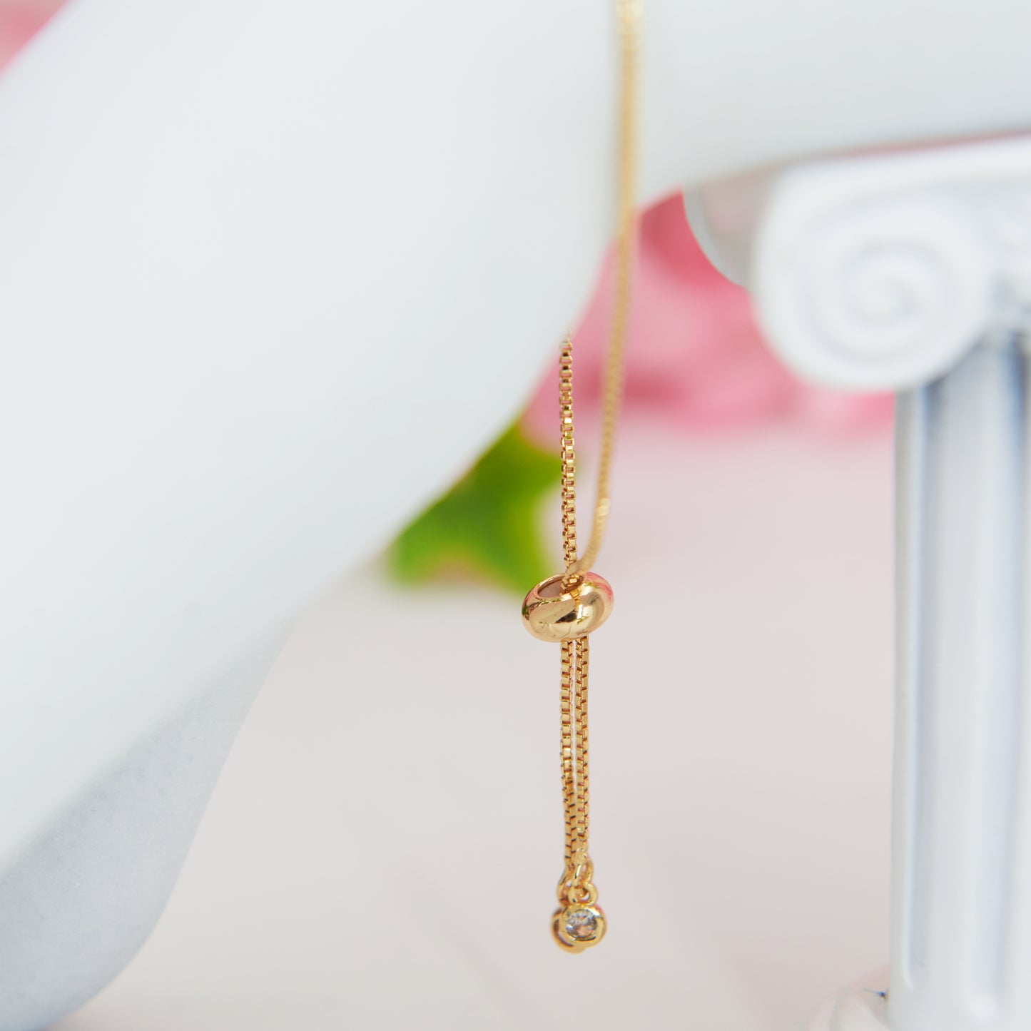Fairycore Blue Butterfly sparkling pendant bracelet with gold chain and a slider for adjustment.